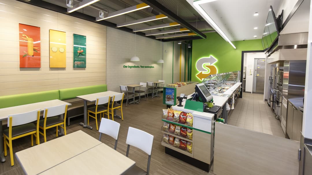 Complete interior paint transformation of a Subway restaurant