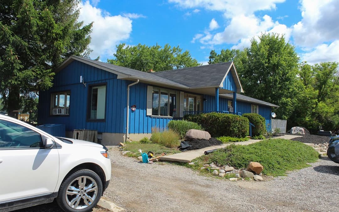 Bright blue club house of the Fox Golf Club