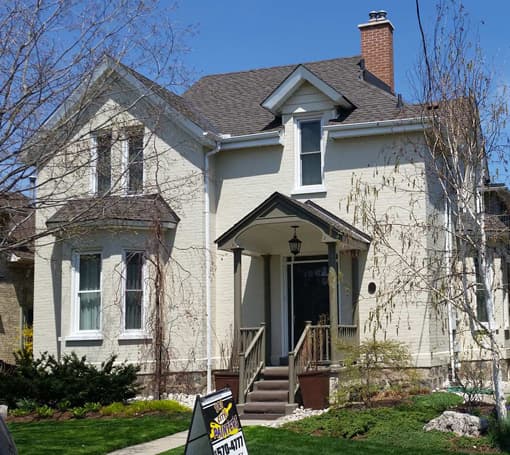 A brightly painted white house exterior