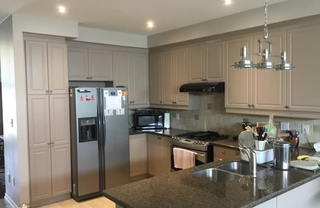 Bright modern kitchen with resprayed cabinets