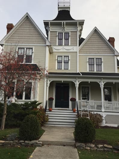The exterior of a beautiful victorian home with a fresh coat of paint